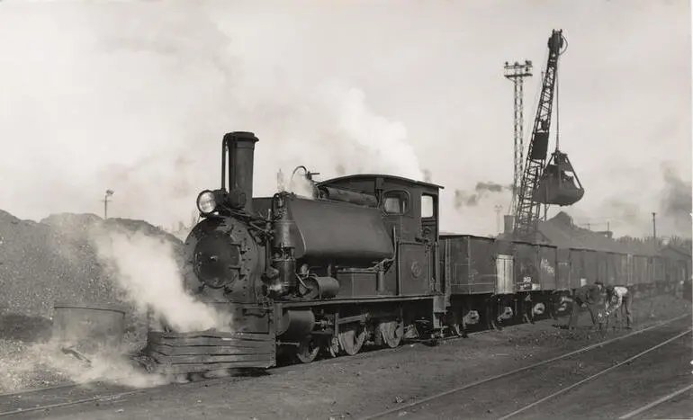 Image: Steam locomotive F 257 with coal trucks, 1940s
