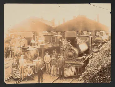 Image: Steam locomotive and staff at rail yard