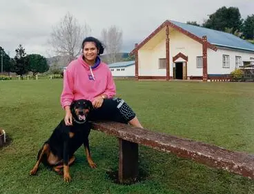 Image: Jacqueline Rangi Pokaia Carmel Clark in front of Rangiwahitu Whare Whakairo at Tauranganui Marae, Port Waikato