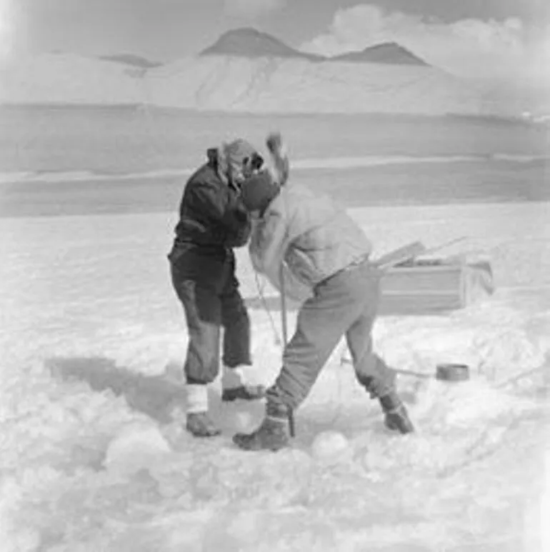 Image: A Packard and Dr R Balham cut a hole through ice