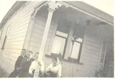 Image: 2 men and 2 women on verandah of a villa c1906.