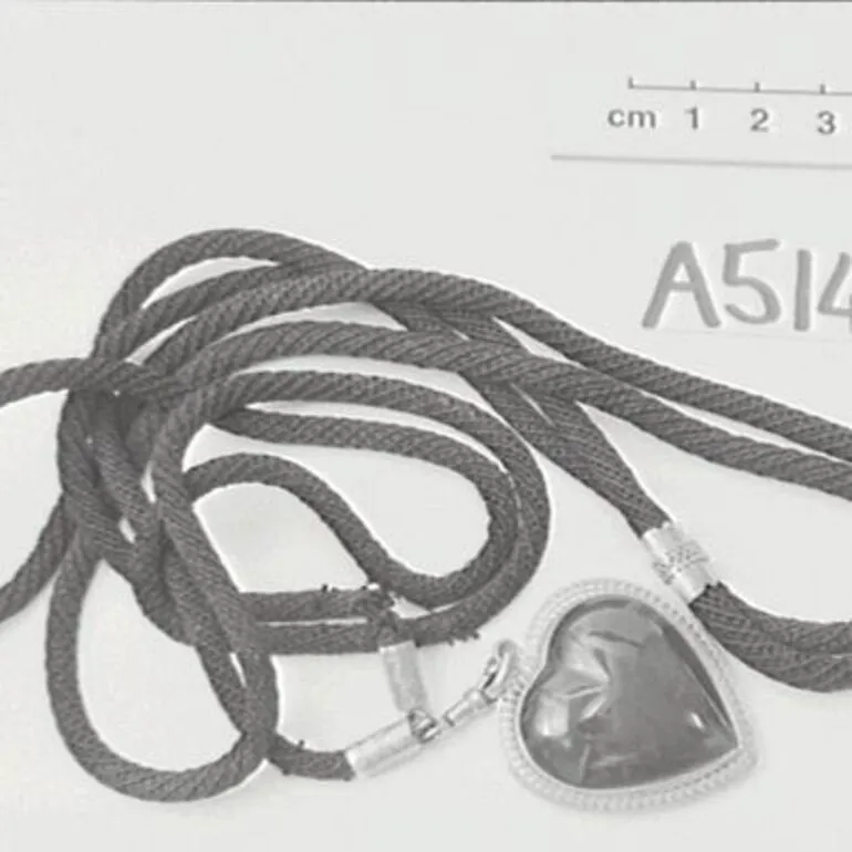 Image: Greenstone pendant enclosing a lock of hair