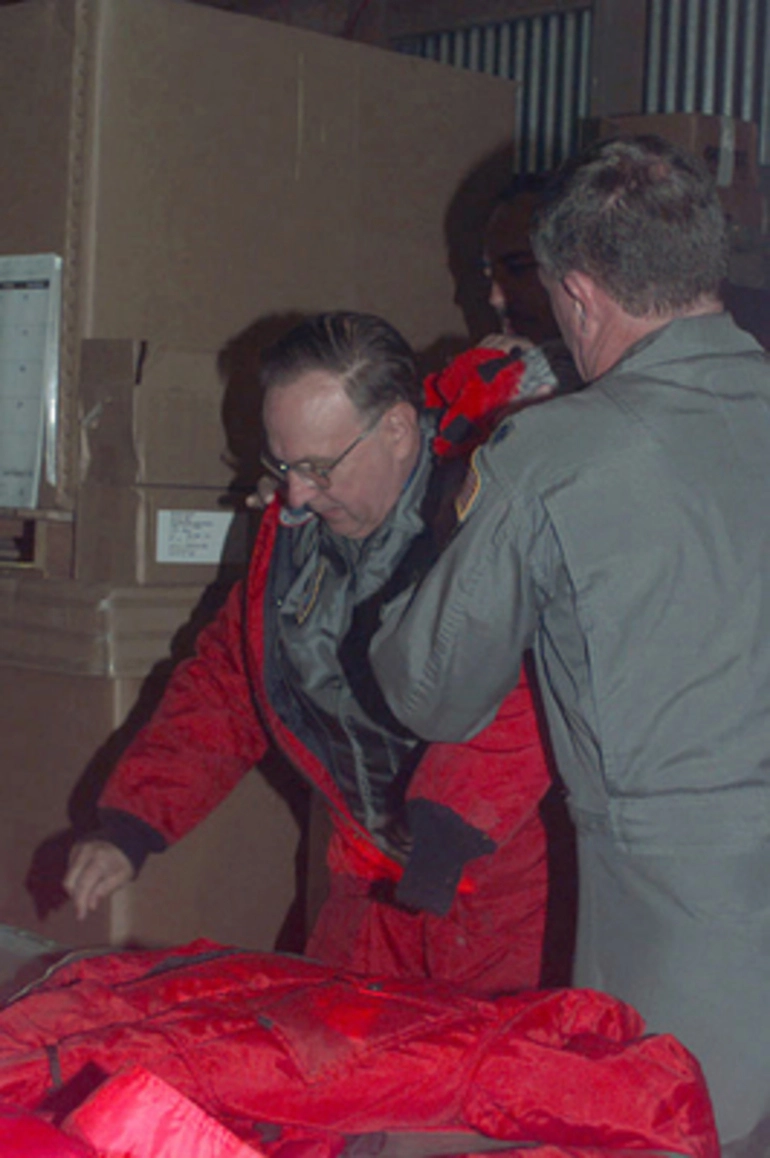 Image: Major General (MGEN) John M. Miller (Left), the Air Mobility Command's Military Assistant assigned to Scott Air Force Base, Illinois, is fitted into extreme cold weather gear in Christchurch, New Zealand, prior to flying to McMurdo Base in Antarctica. MGEN Miller is in Christchurch to observe the Air Force's participation in Operation DEEP FREEZE. DEEP FREEZE is a joint military operation of the US Armed Forces and the New Zealand Defense Forces to provide logistic support for the US National Science Foundation's Antarctic Program