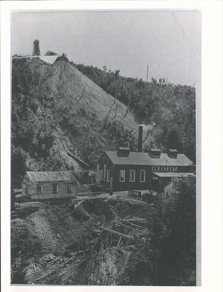 Image: View of winding engine shed, rope & poppet head above mine shaft