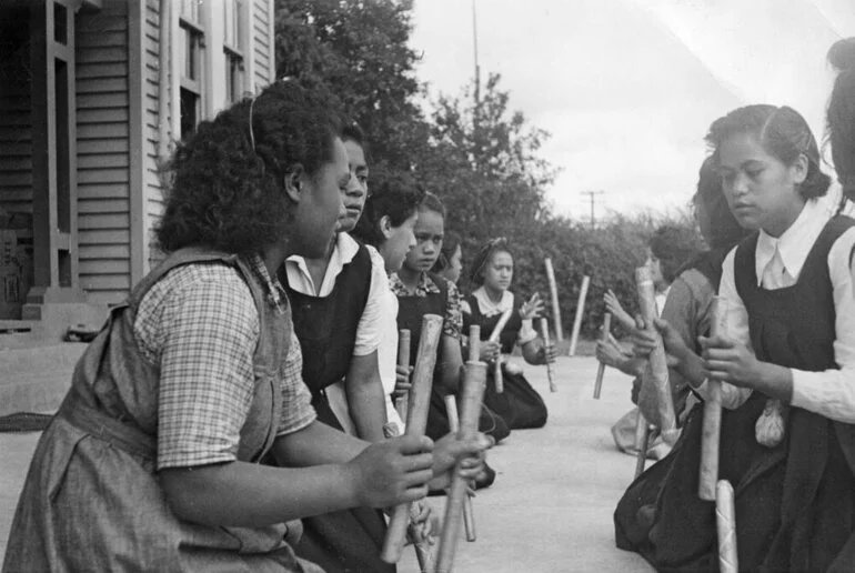 Image: Girls playing stick game