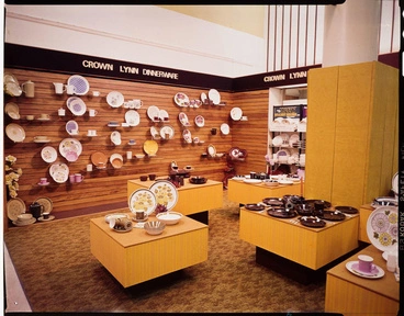 Image: Transparency - Interior of Crown Lynn Shop, with low plinths and mounted wall display, Crown Lynn Dinnerware signage