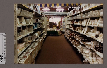 Image: Photograph - Aisle in shop displaying crockery