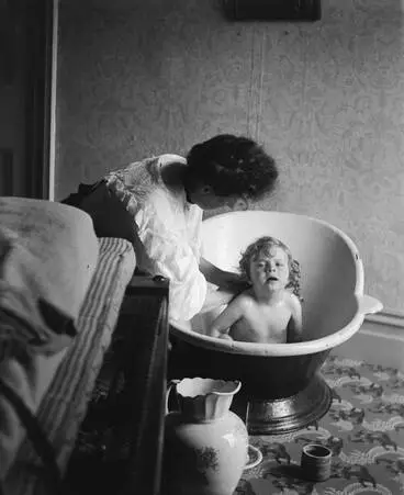 Woman bathing a child, Arney Road, Remuera, 1905 Image: Woman bathing a child, Arney Road, Remuera, 1905