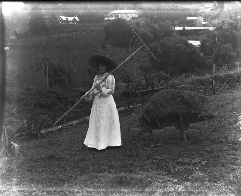 Image: Woman holding a hay rake, Arney Road, Remuera, 1905