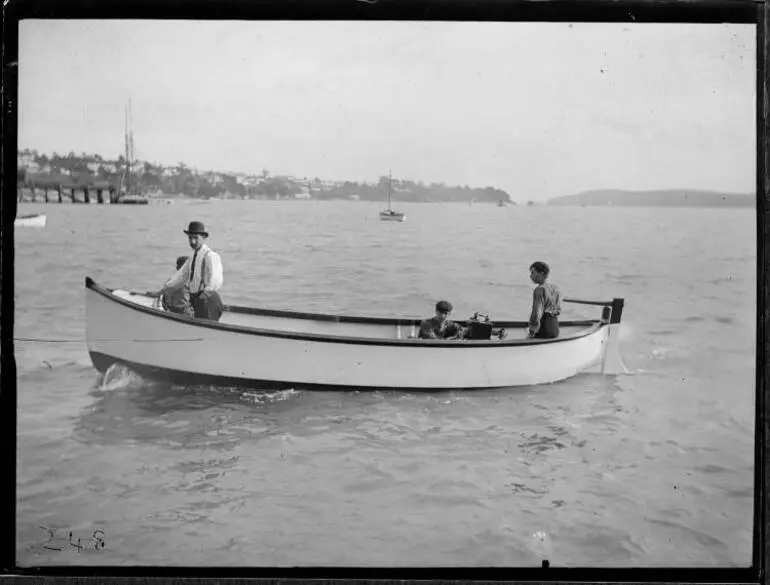 Image: Four men in the dinghy Kaeo in the Waitematā Harbour