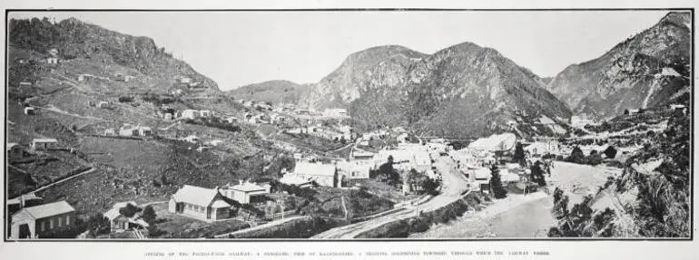 Image: OPENING OF THE PAEROA-WAIHI RAILWAY: A PANORAMIC VIEW OF KARANGAHAKE, A THRIVING GOLDMINING TOWNSHIP, THROUGH WHICH THE RAILWAY PASSES