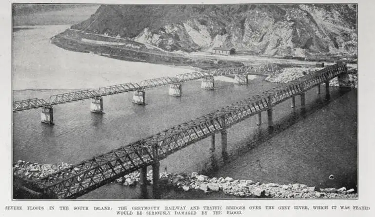 Image: SEVERE FLOODS IN THE SOUTH ISLAND: THE GREYMOUTH RAILWAY AND TARFFIC BRIDGES OVER THE GREY RIVER, WHICH IT WAS FEARED WOULD BE SERIOUSLY DAMAGED BY THE FLOOD