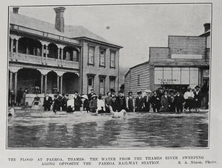 Image: THE FLOOD AT PAEROA, THAMES: THE WATER FROM THE THAMES RIVER SWEEPING ALONG OPPOSITE THE PAEROA RAILWAY STATION
