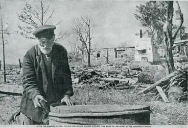 Image: After the bombers passed: an old collective farmer surveys the ruins of his home in the Leningrad region