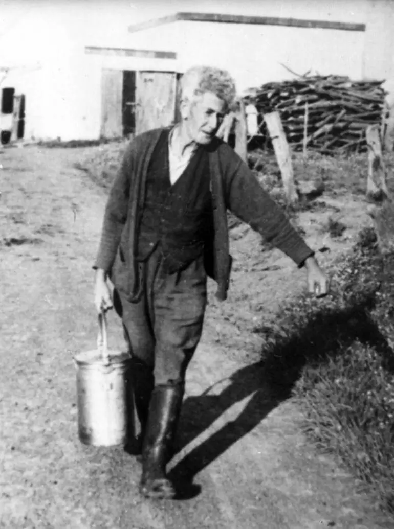 Image: Albert Bailey carrying milk.