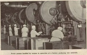 Image: Power presses handled by women in operations at a factory producing war materials