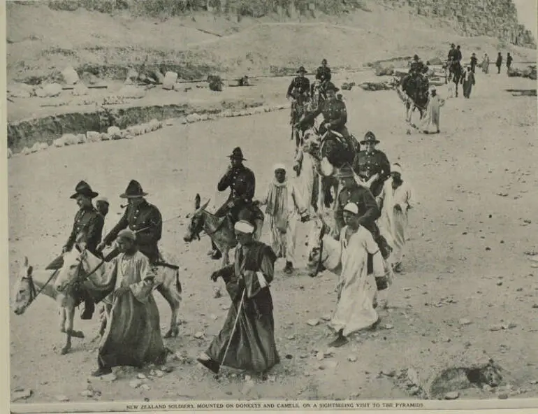 Image: New Zealand soldiers, mounted on donkeys and camels, on a sightseeing visit to the pyramids