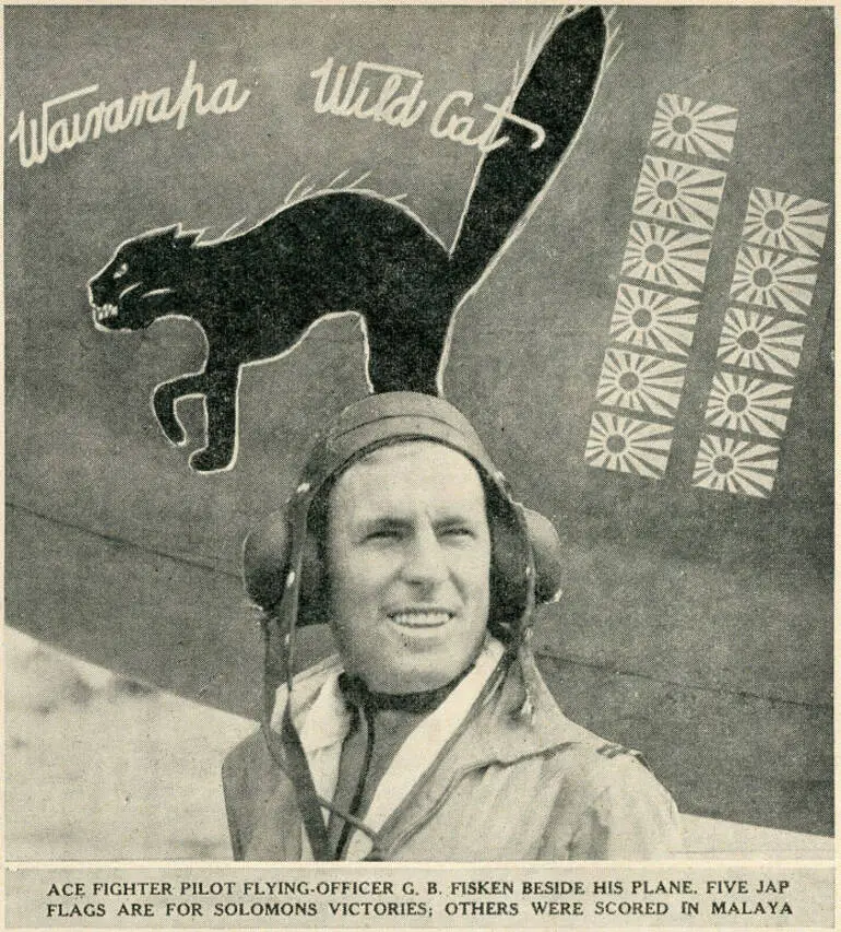 Image: Ace fighter pilot Flying-Officer G. B. Fisken beside his plane. Five Jap flags are for Solomons victories; others were scored in Malaya