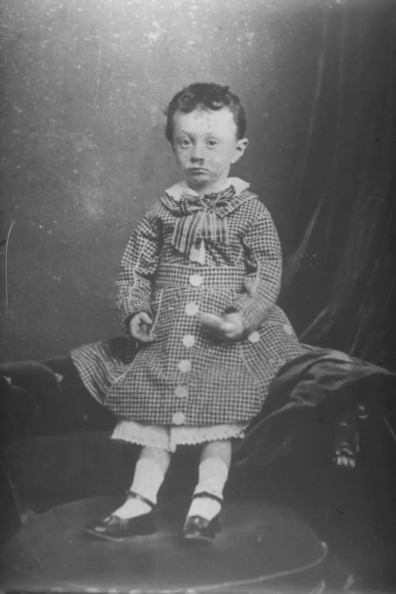 Image: Child standing on a couch