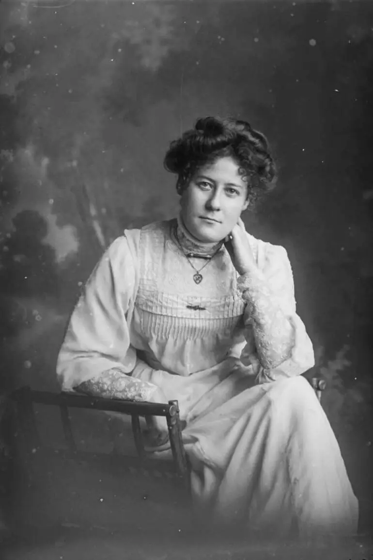 Image: Miss Swanson leaning her left elbow on books, 1909