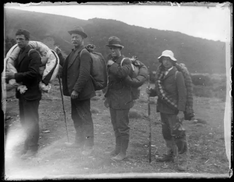 Image: Four men on a tramping expedition
