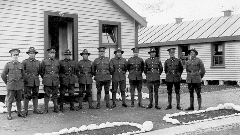 Image: Soldiers outside a hut at Featherston Military Training Camp