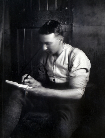 Image: A soldier writing a letter inside : negative