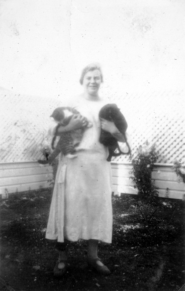 Image: Mary King holding two cats : digital photograph