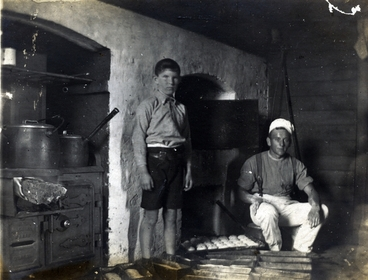 Image: Man and boy in a cookhouse : digital image