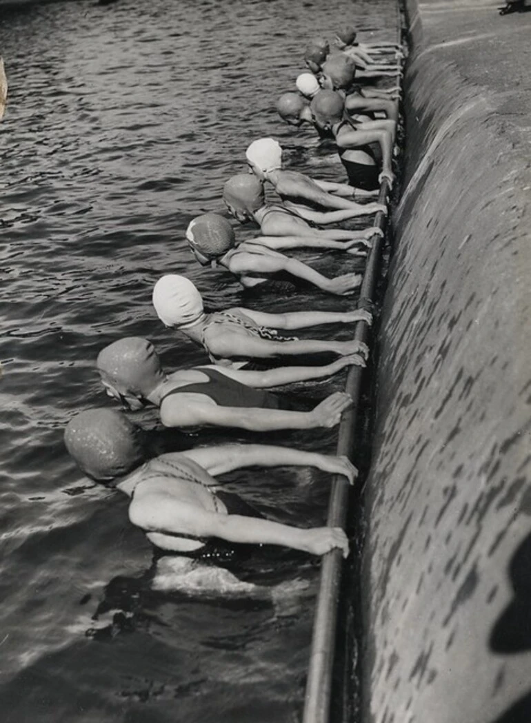 Image: Swimmers during learn to swim week, at a suburban swimming pool, probably Wellington region, ca 1939