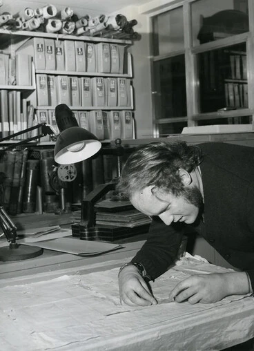 Image: Archivist, T.J. Lovell-Smith works on the restoration of an early map (c1976)