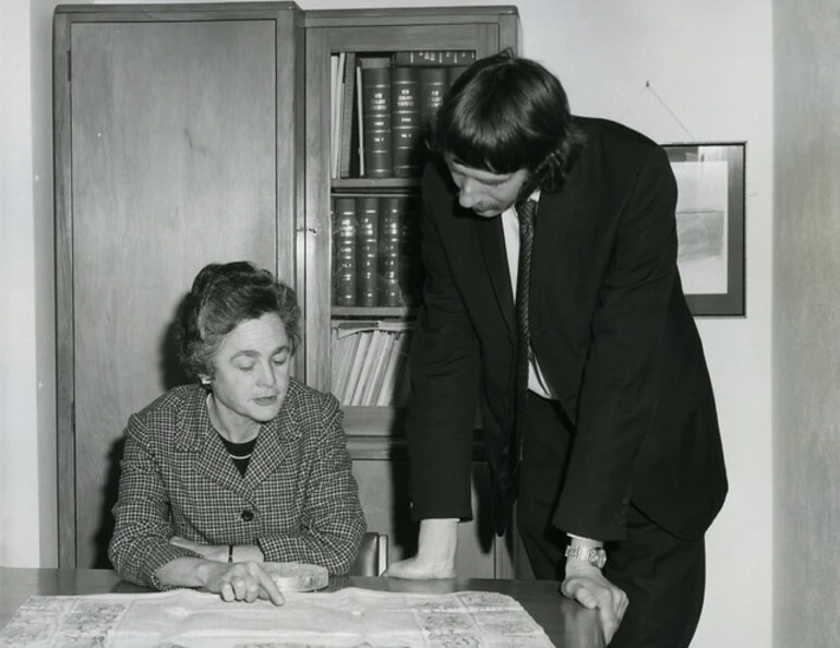 Image: Judith Hornabrook, Chief Archivist and archivist Owen Davie, examine the charter by which New Zealand was constituted a colony on 16 November 1840 (c1976)