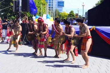 Image: CAR NZ male dance group members beating gongs