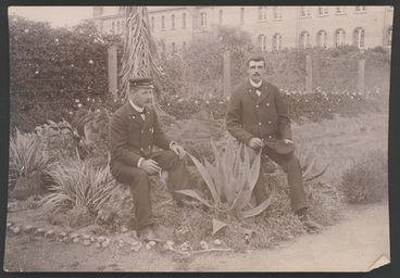 Image: [Two guards sitting on tree stumps smoking, Avondale Lunatic Asylum]