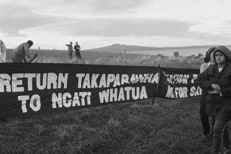 Image: Protestors with banner 'Return Takaparawhā to Ngati Whatua Bastion Point Not For Sale'. Auckland Orakei Bastion Point Occupation