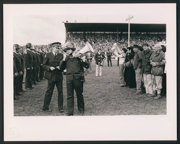 Image: [A police line and protesters face off on the rugby pitch at Rugby Park, Hamilton]