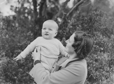 Image: [Woman holding a baby]