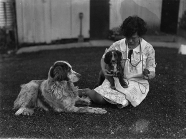 Image: [Woman with two dogs and a rabbit]