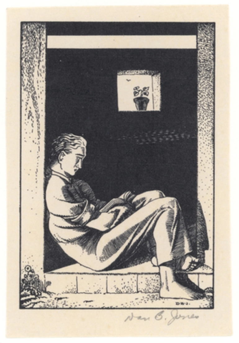 Image: [Man sitting in doorway reading]