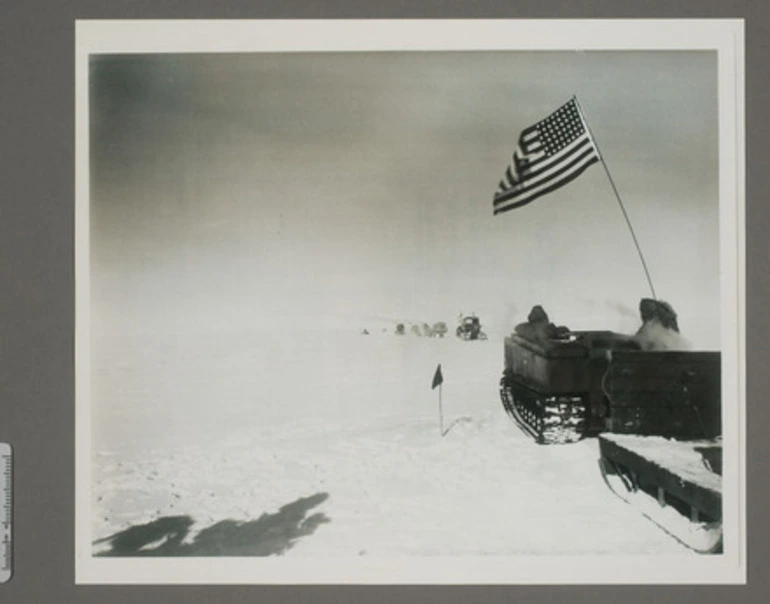 Image: Dr V. Fuchs Trans-Antarctic Expedition approaching a greeting party including RADM G. Dufek and Sir Edmund Hillary and news correspondence 2 miles from the south pole station.