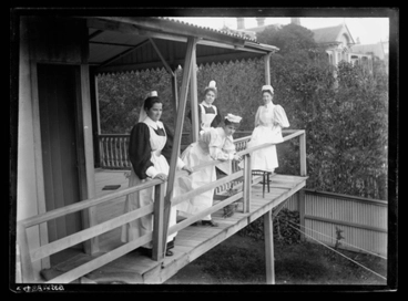 Image: [Portrait of four unidentified nurses]