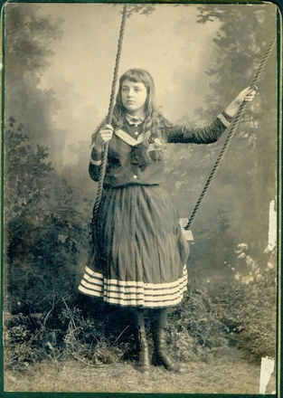 Image: [Young girl on swing]