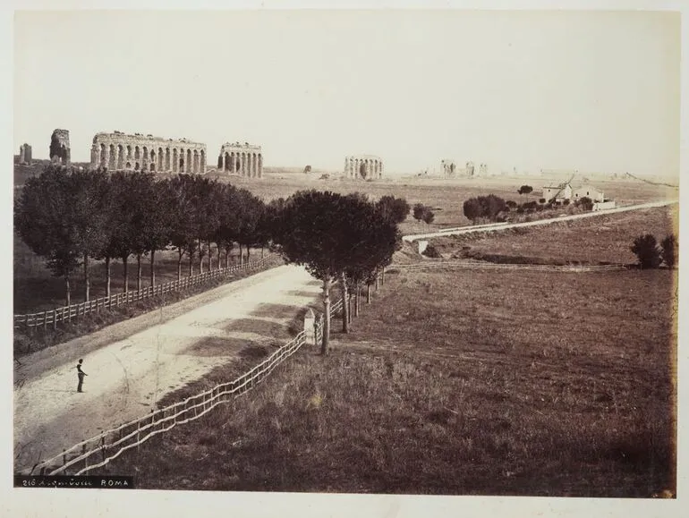 Image: [country road with ruins in background]