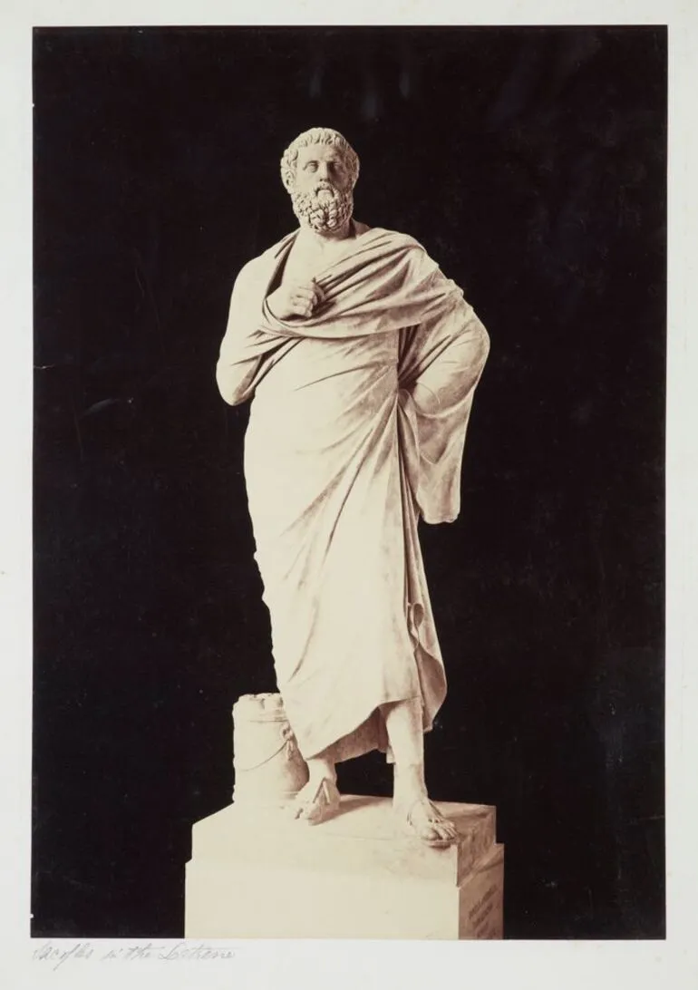 Image: [marble sculpture of male figure in robe]