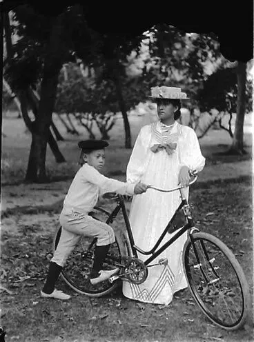 Image: Woman and boy with bicycle