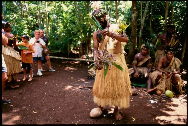 Image: Man holding a coconut crab, Port Vila, Vanuatu