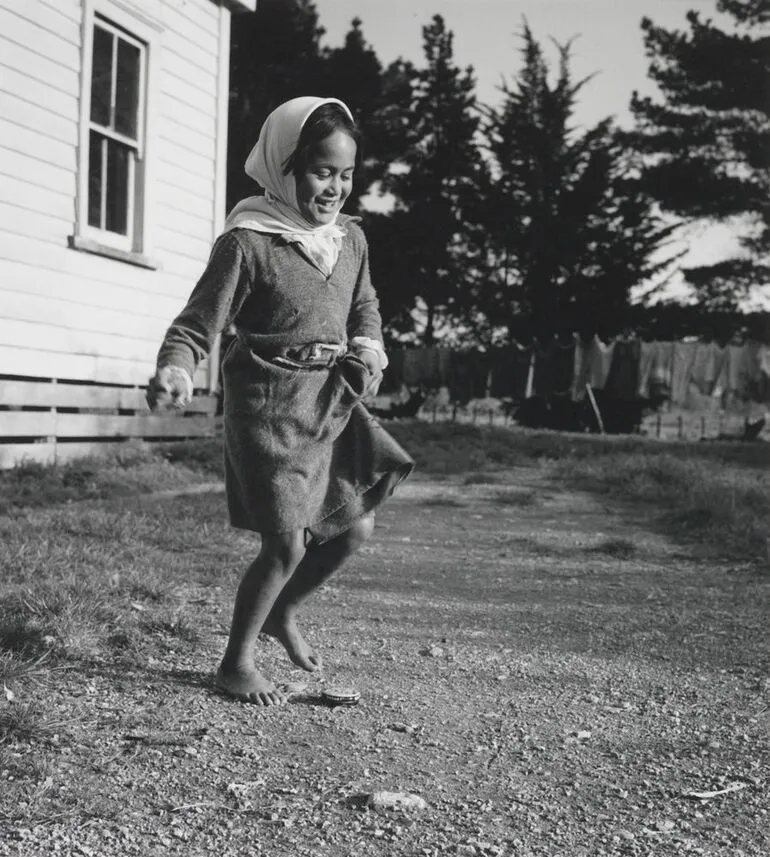 Image: An empty shoe-polish tin is good for practising hop-scotch. From the series: Washday at the pa