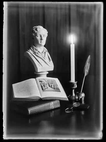 Image: Still life of books, bust of Lord Byron, candle.