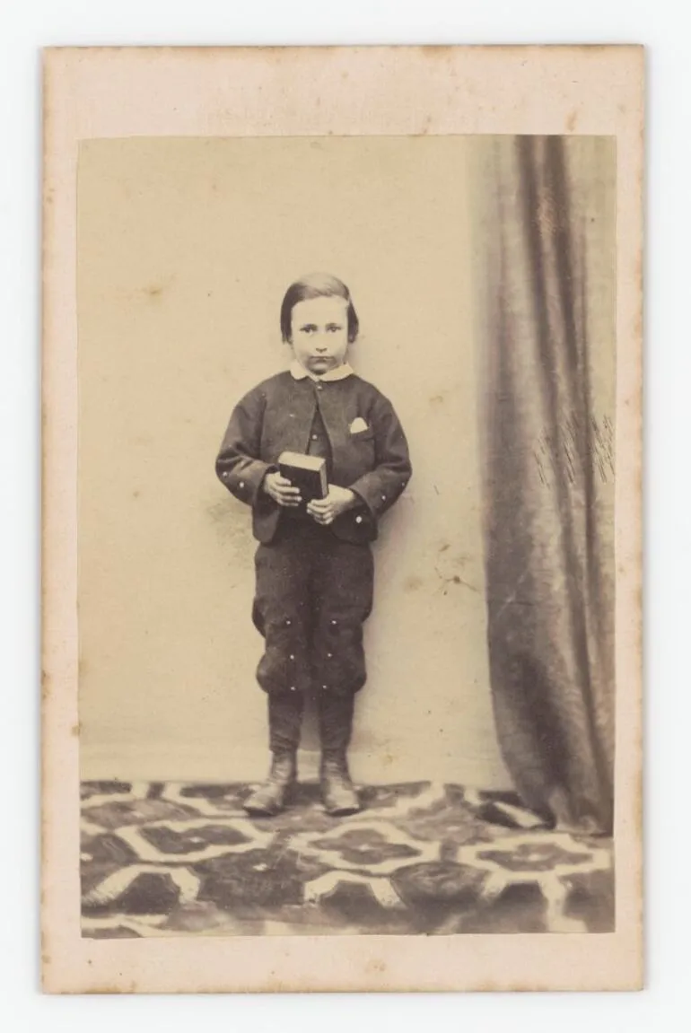 Image: Boy holding a book