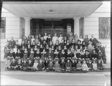 Image: Group of unidentified children and adults, most in Scottish Highland costume outside the Caledonian Hall, Christchurch